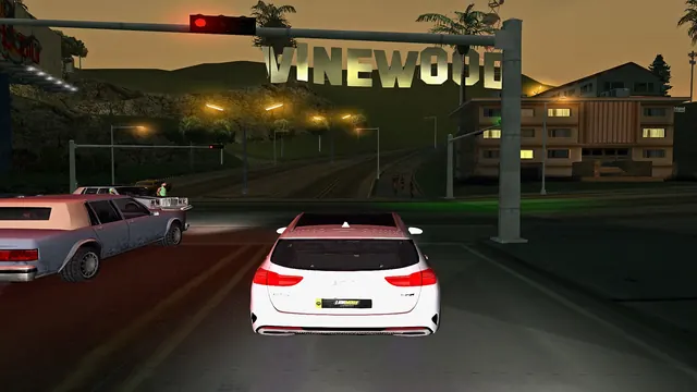 Rear lights at night under the Vinewood sign